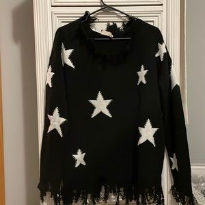 NWOT black distressed sweater & white stars M/L ninexis brand from a boutique